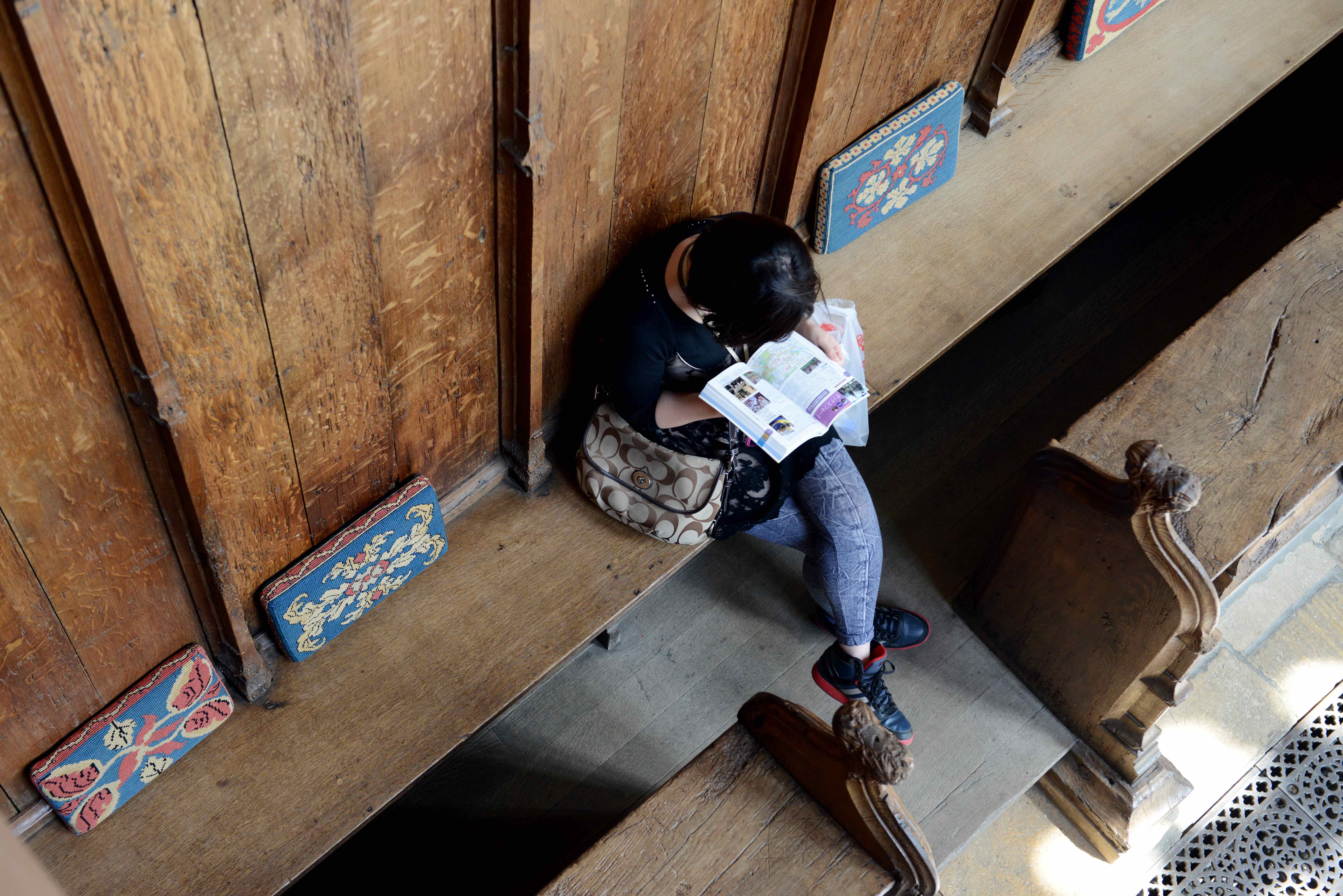 Person reading in stalls