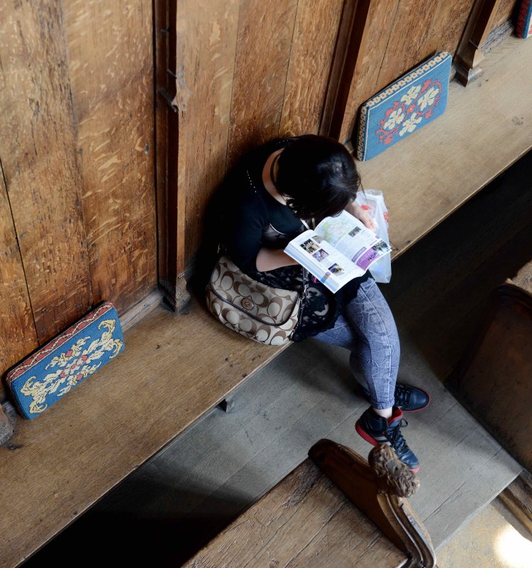Person reading in stalls